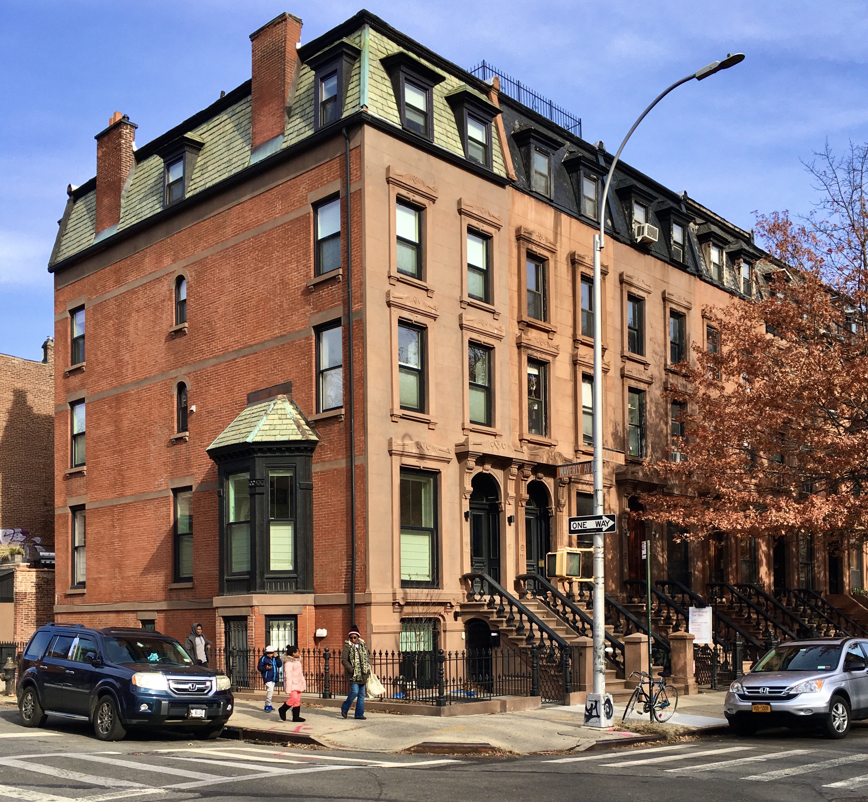 Handsome homes 63 (at left) to 69 Gates Ave. were built in the 1880s. Photo: Lore Croghan/Brooklyn Eagle