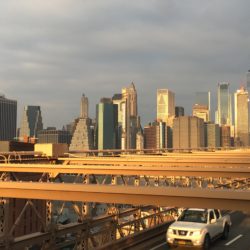 Early-morning sunlight brightens the World Trade Center’s facade, seen from the Brooklyn Bridge’s pedestrian and cyclist pathway. Photo: Lore Croghan/Brooklyn Eagle