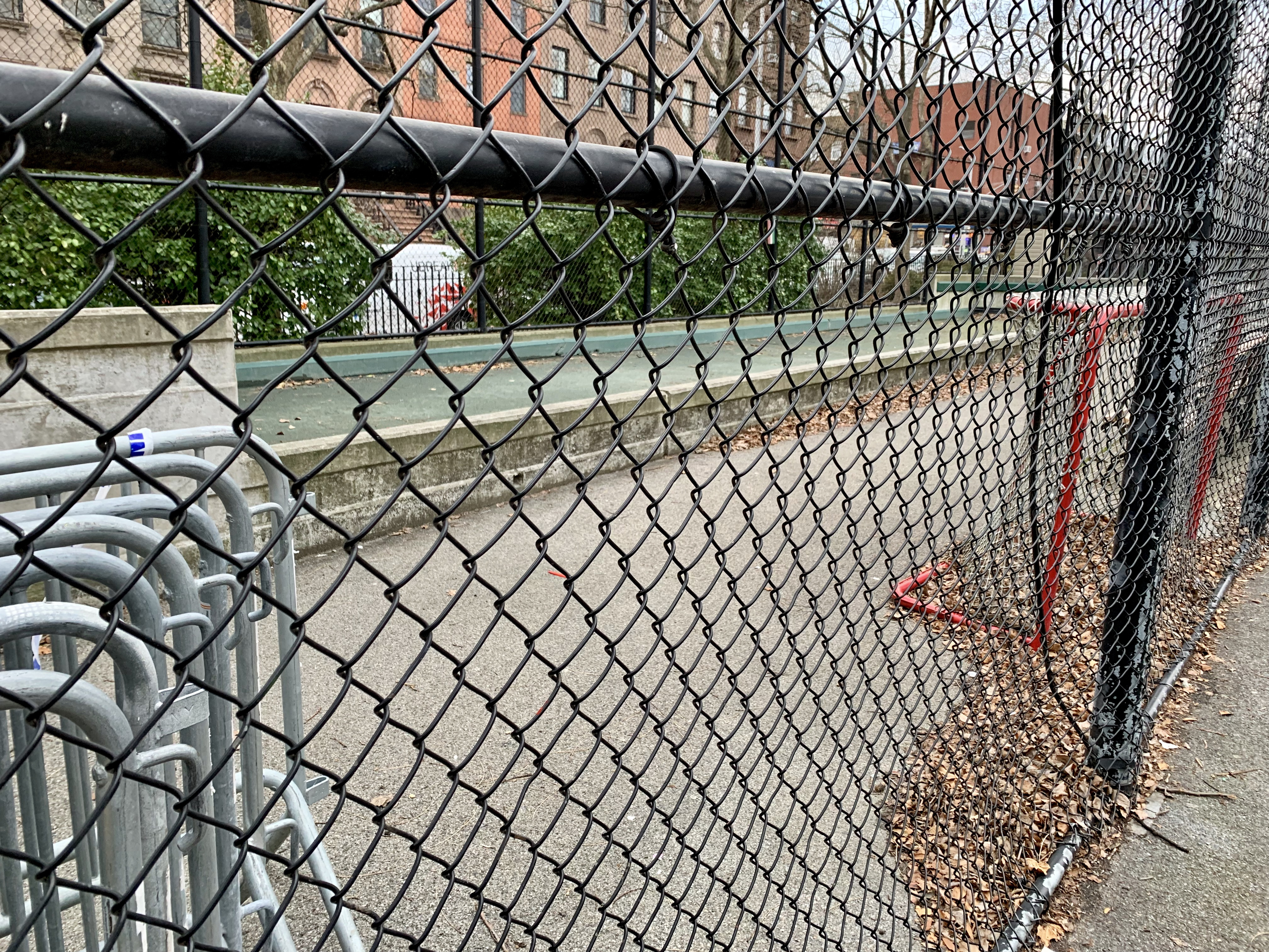 The bocce court behind this fence may soon disappear. Photo: Mary Frost/Brooklyn Eagle