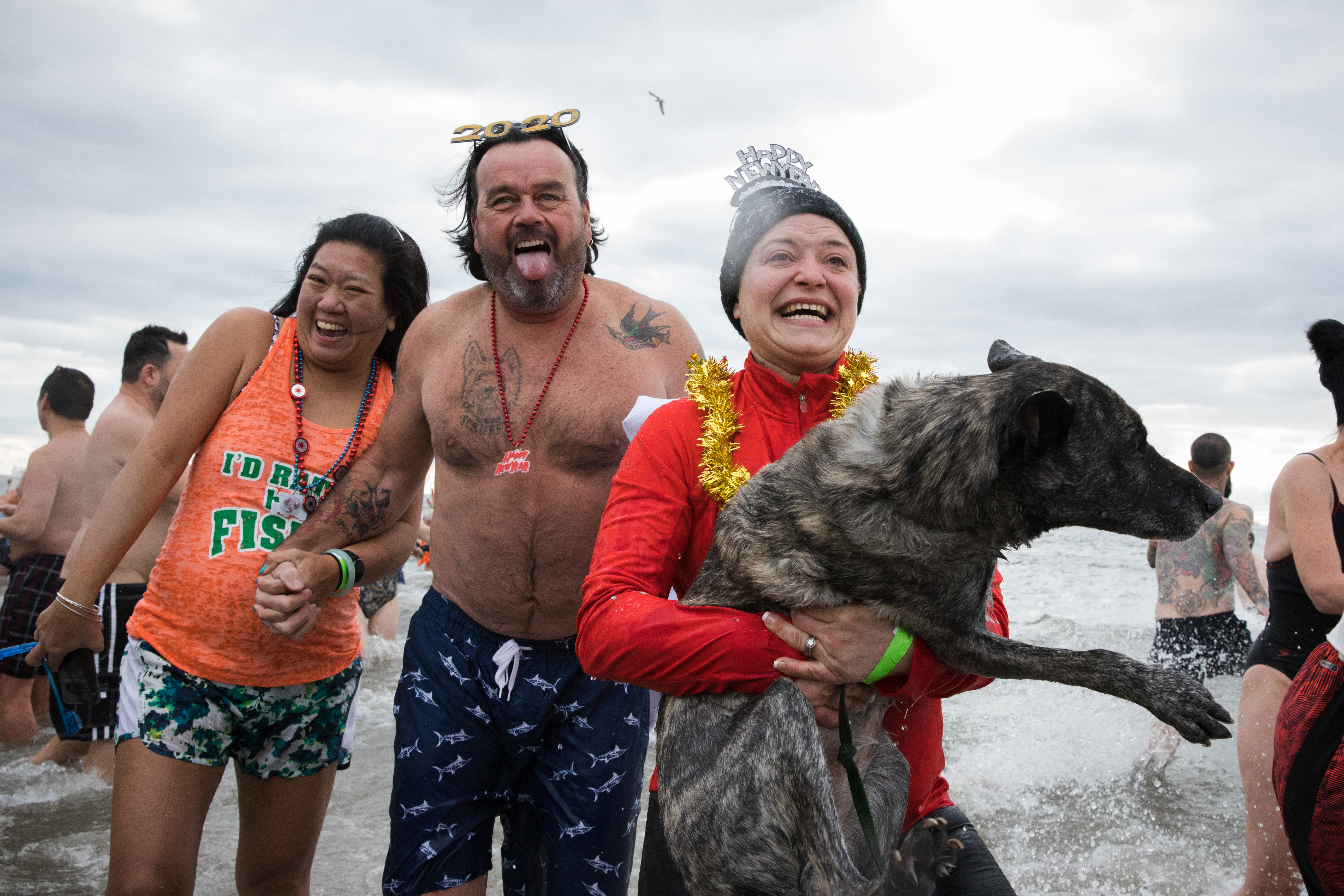 Some participants wore costumes in the water, and some brought along their weary pets. 