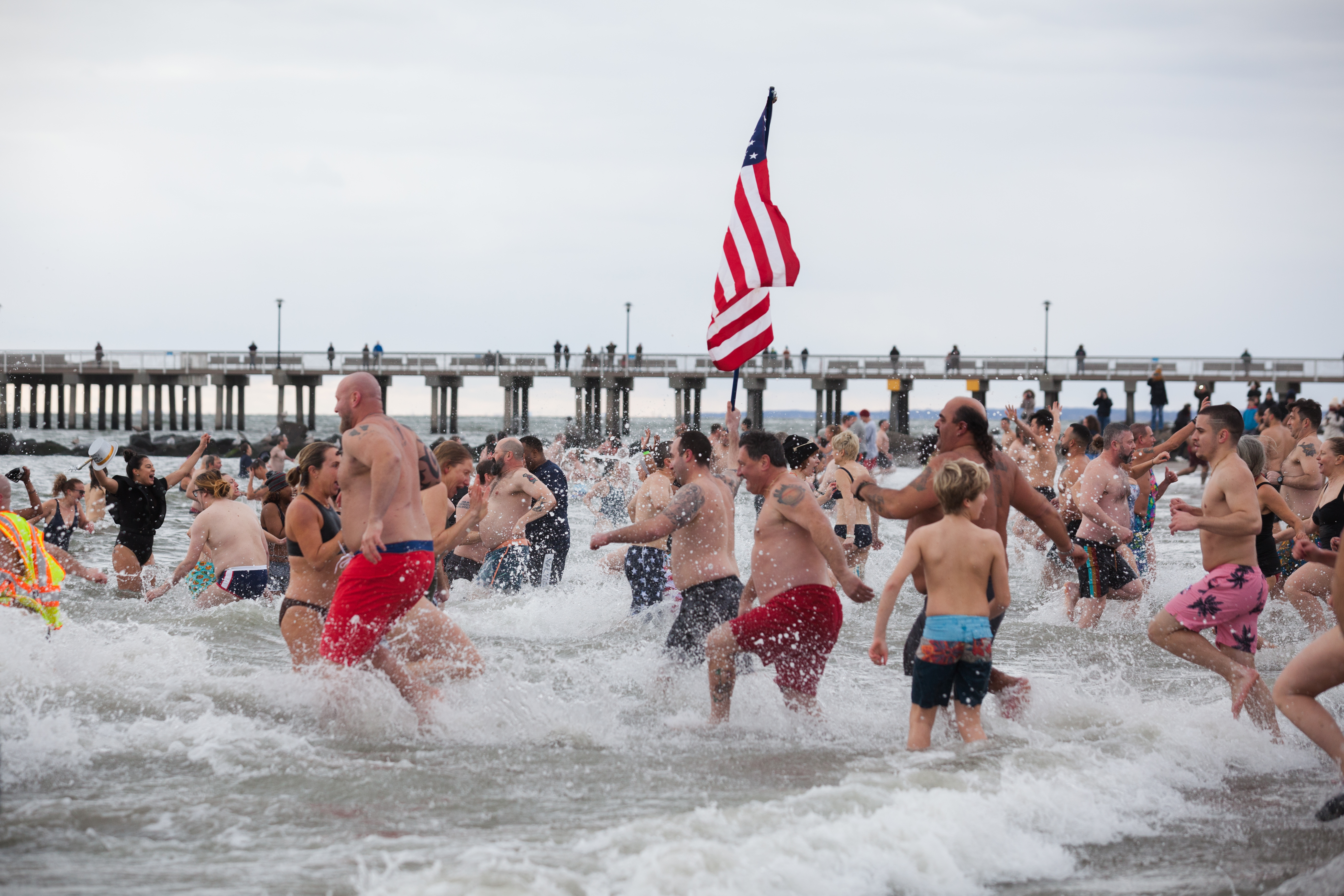 A crowd of spectators turned into participants when they ran into the water as well.