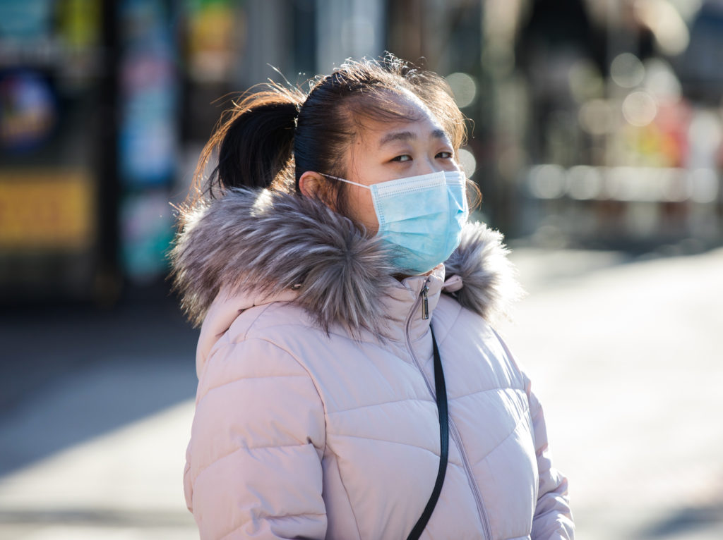 Medical masks, like the one worn by this woman in Sunset Park, are in short supply in Brooklyn and around the world. Photo: Paul Frangipane/Brooklyn Eagle
