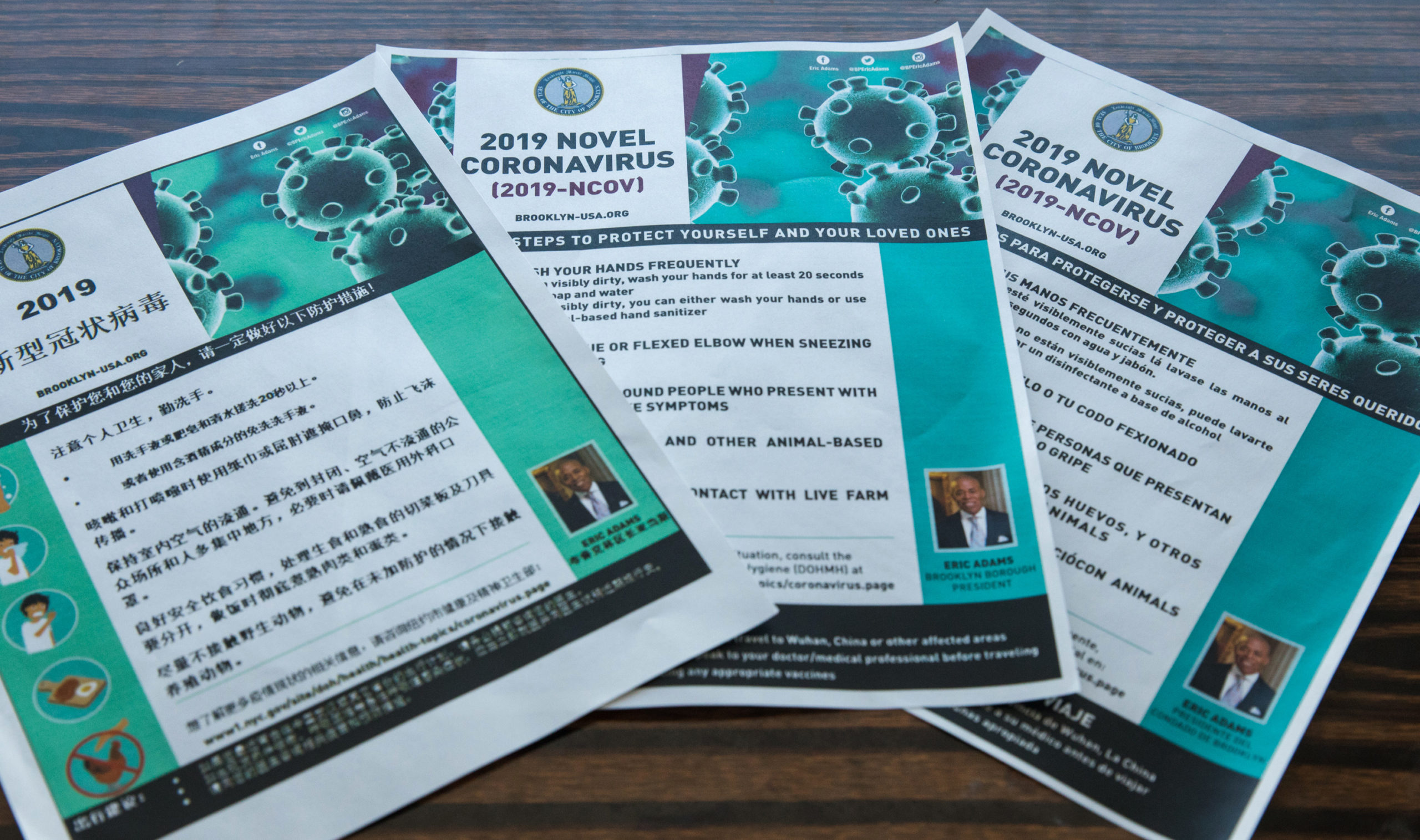 Borough President Eric Adams handed out flyers in three languages with information to help prevent contracting the coronavirus. Photo: Paul Frangipane/Brooklyn Eagle