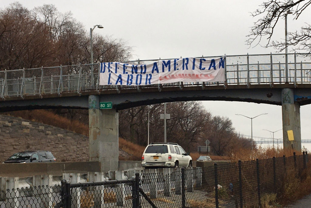 A banner promoting a white nationalist website stretched over the Belt Parkway. The group's website has been blurred out. Photo: BayRidgeDrivers/Twitter