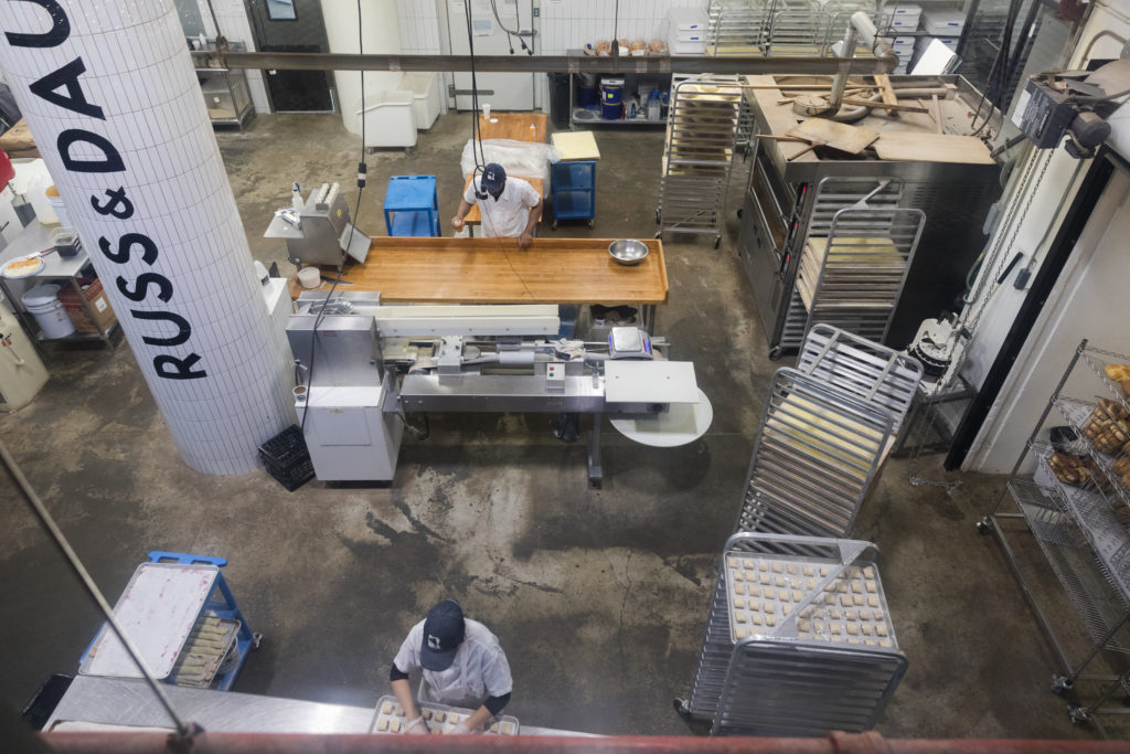 Visitors can climb a set of stairs for a bird’s eye view of Russ & Daughters’ Navy Yard production space. Photo: Paul Frangipane/Brooklyn Eagle