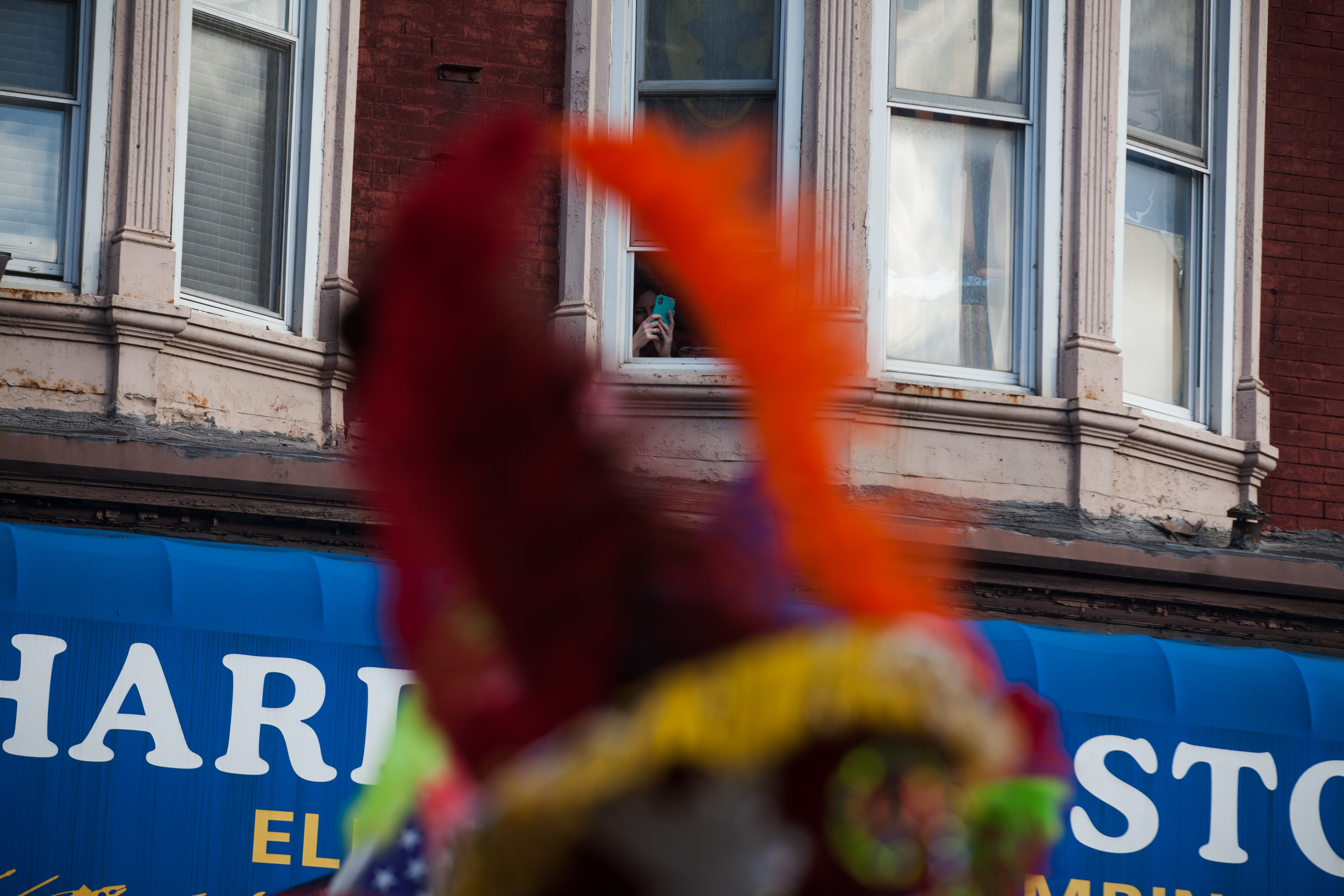 Neighbors on Graham Avenue were quick to point their phones to the street to film the parade.