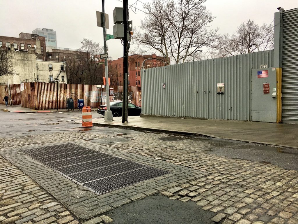 Residential development is planned at two fenced-in lots at the intersection of Front and Gold streets in Vinegar Hill. Photo: Lore Croghan/Brooklyn Eagle