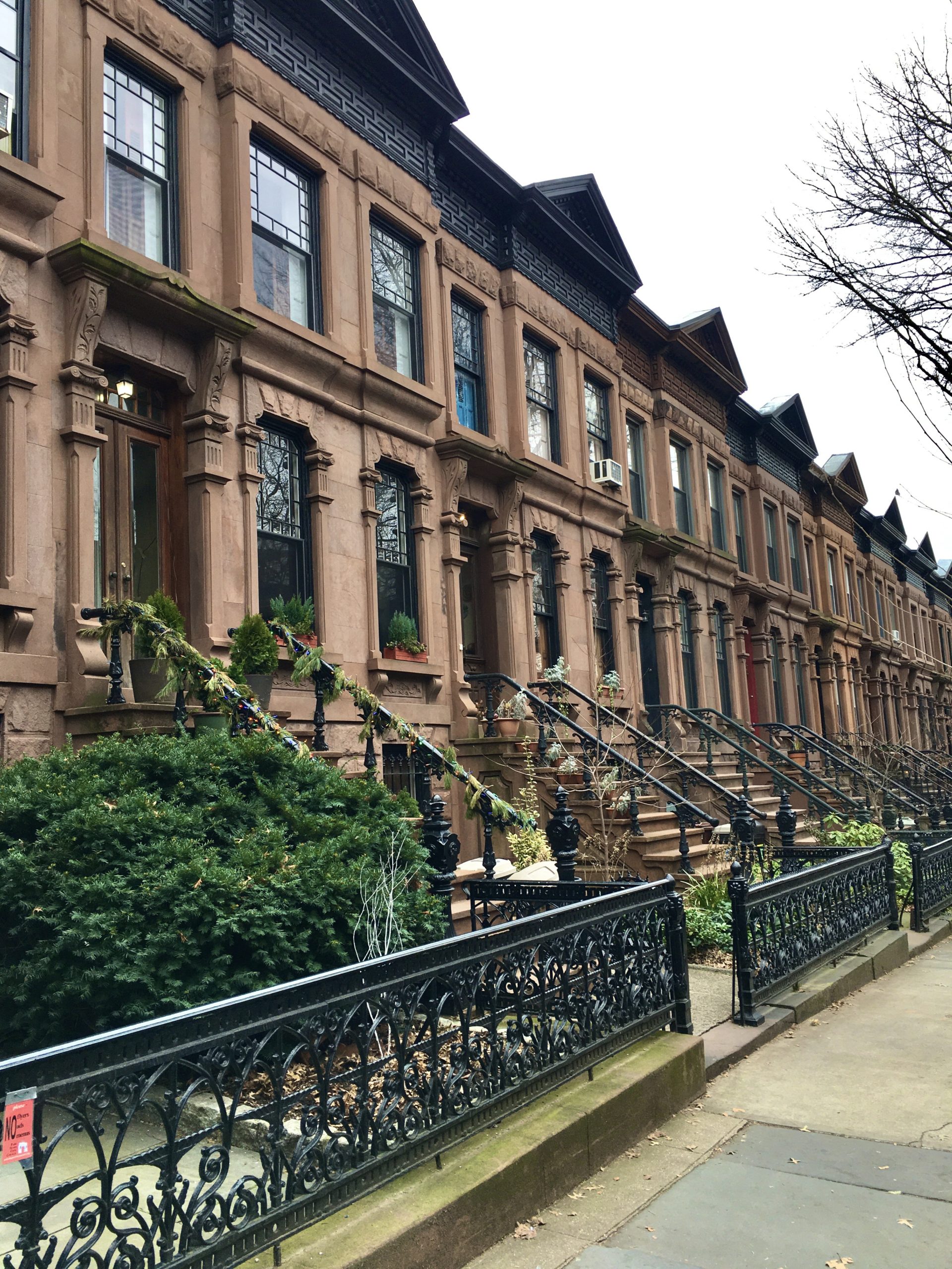 These brownstone homes with nifty roofs can be found on 1st Street between Fifth and Sixth avenues. Photo: Lore Croghan/Brooklyn Eagle