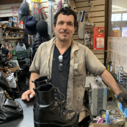 Fernando Costano, a long-time employee at Brooklyn Heights Shoe Master in the Clark Street Station arcade, says closing the station for eight months could put the shop out of business. Photo: Mary Frost, Brooklyn Eagle