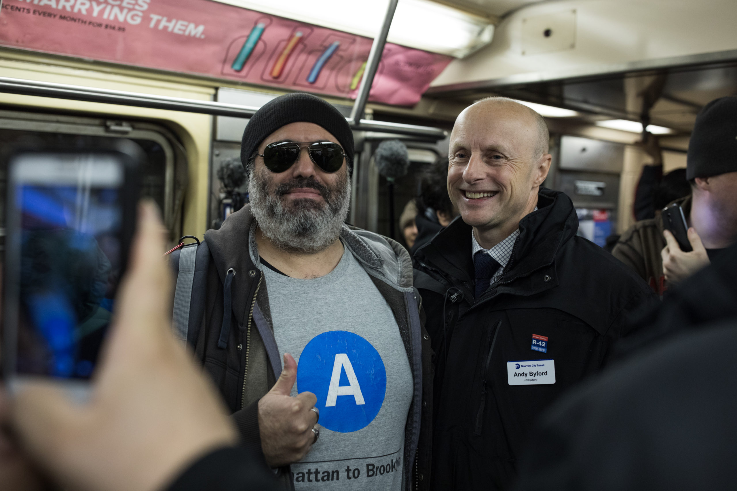 Lorenzo Paz, left, poses with NYC Transit President Andy Byford as they take the final ride of the R-42 subway cars. Paz is a transit buff and used the ride as a type of early birthday celebration. Photo: Paul Frangipane/Brooklyn Eagle