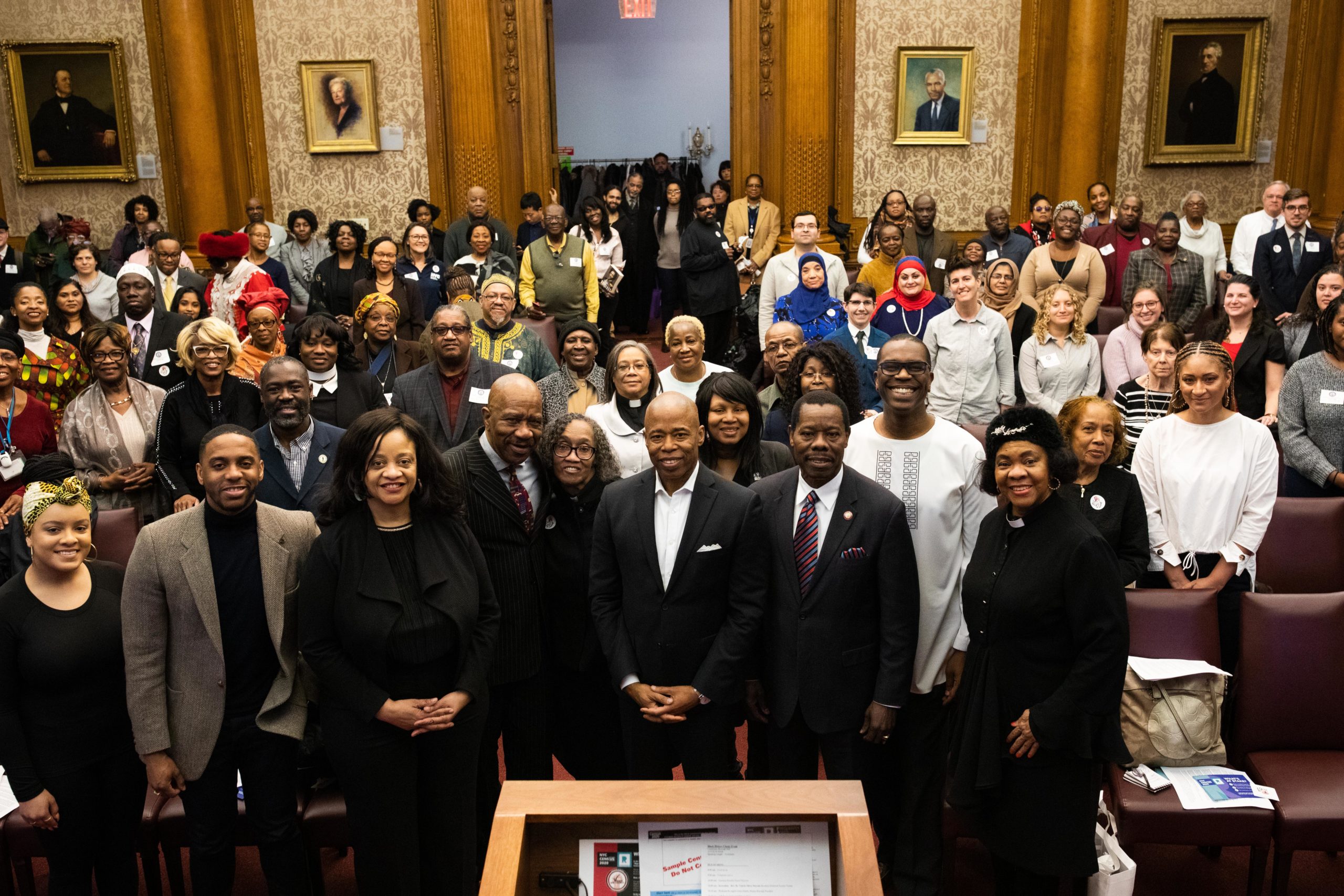 Borough President Eric Adams poses for a photo with local clergy members at a Black History Month event at Borough Hall. Photo: Paul Frangipane/Brooklyn Eagle
