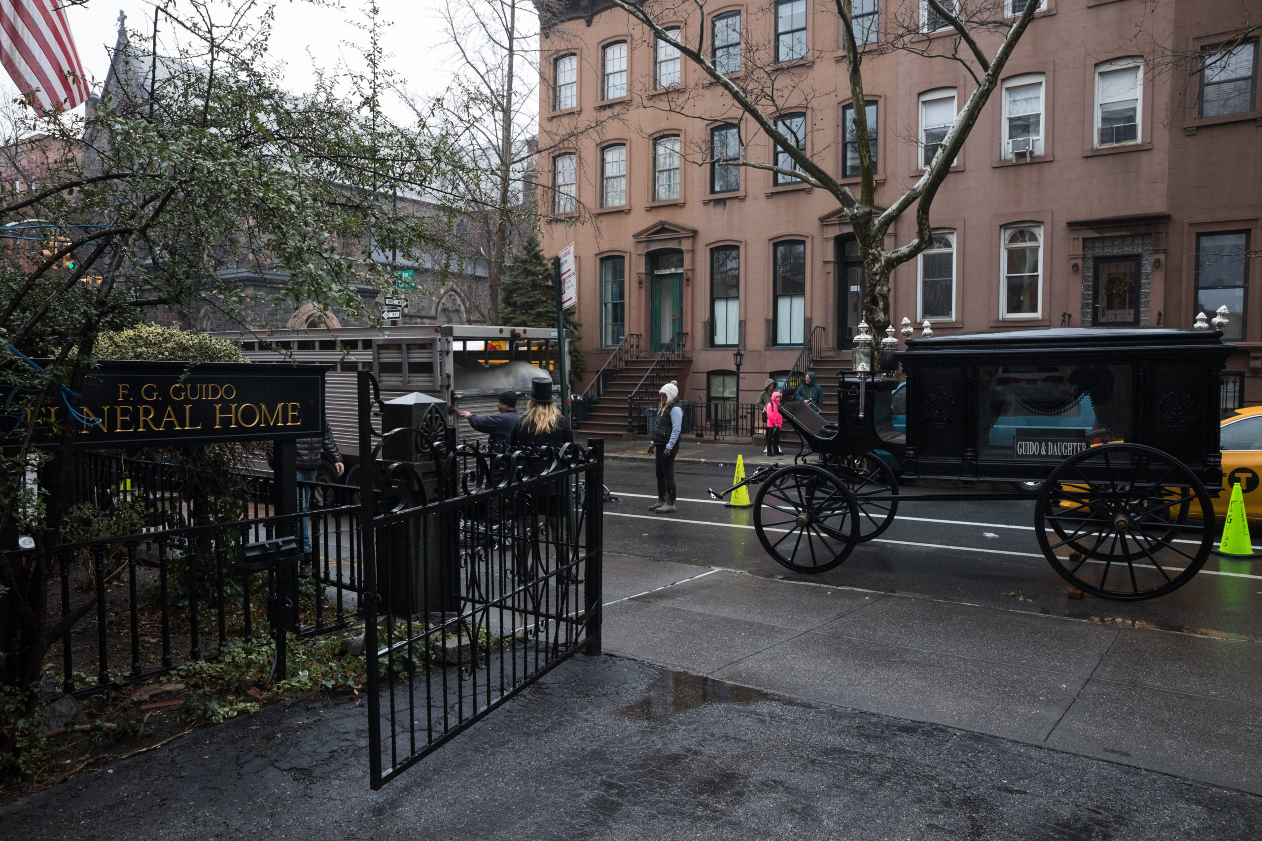 The Guido family's 1888 Studebaker horse-drawn hearse sits in front of their Clinton Street funeral home to prepare for a procession. Photo: Paul Frangipane/Brooklyn Eagle