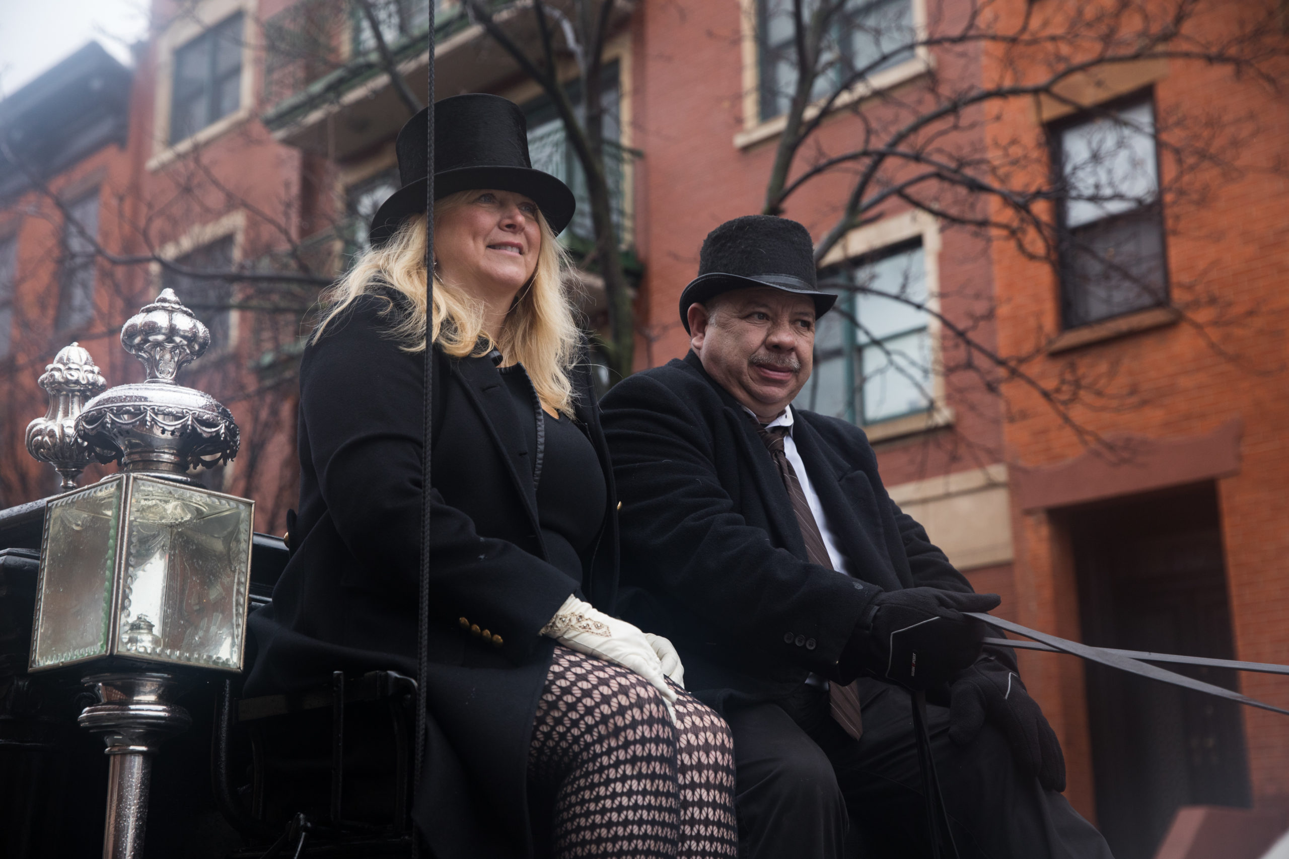 Guido rides passenger on the horse-drawn hearse that's been in her family since the 1800s. 