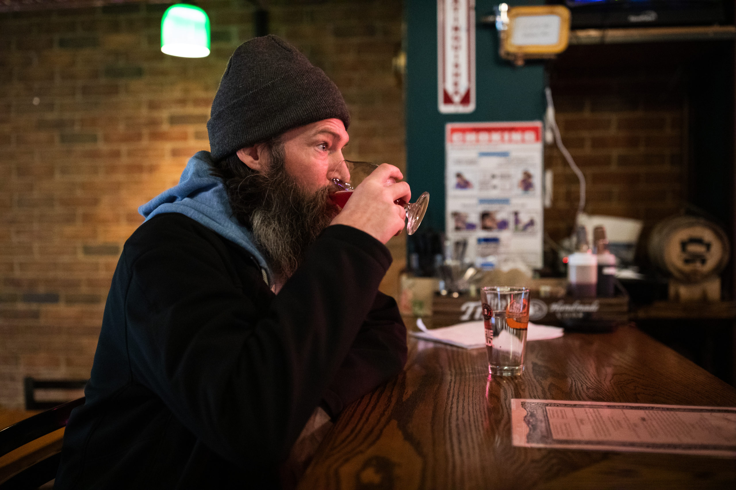 Aaron Curran drinks at the bar of Someday in Boerum Hill on March 16, 2020. Gov. Andrew Cuomo previously ordered all bars and restaurants would have to close by 8 p.m. on the 16th. They could continue with takeout and delivery. Photo: Paul Frangipane/Brooklyn Eagle