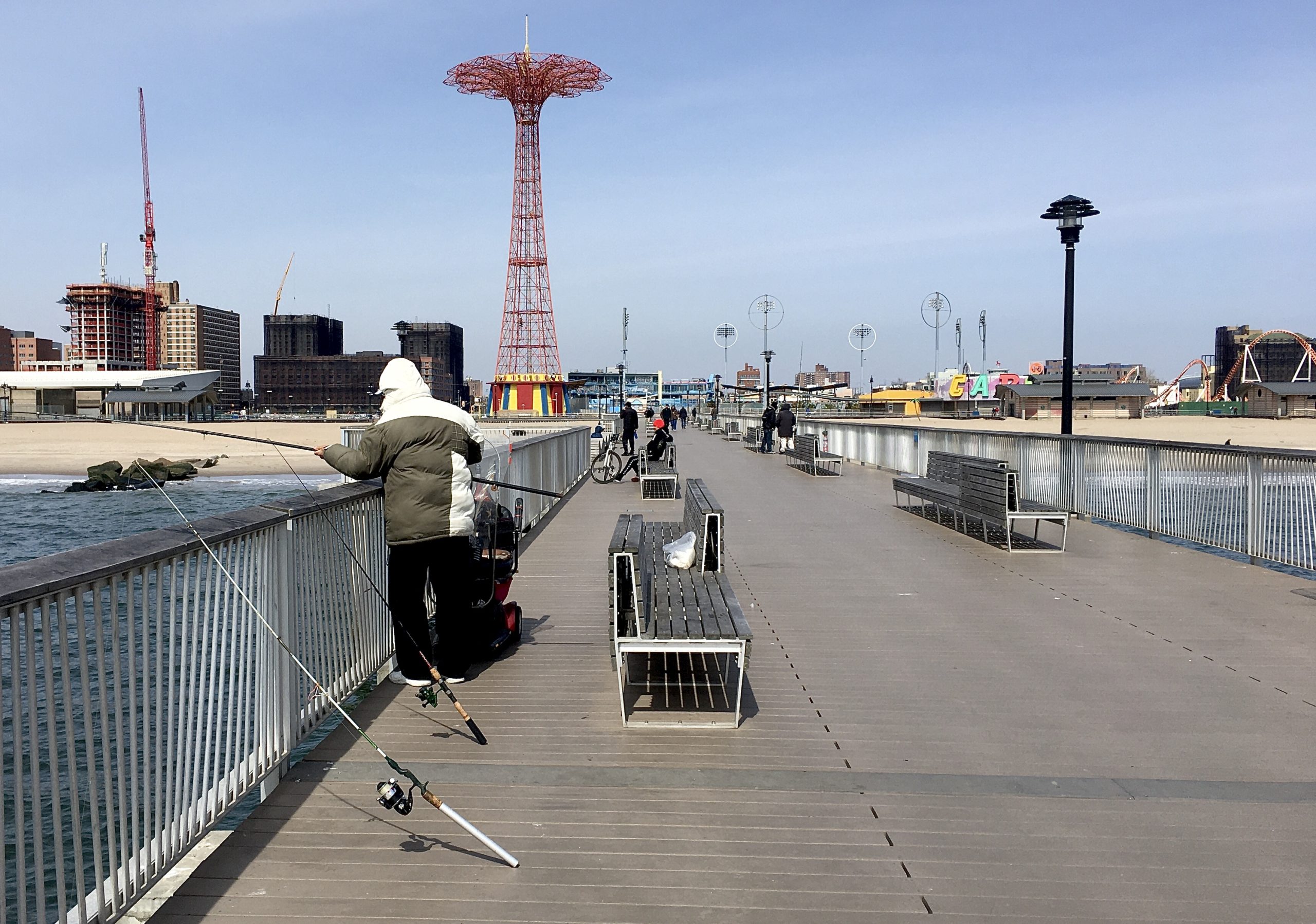 This fellow is fishing on Pat Auletta Steeplechase Pier. Photo: Lore Croghan/Brooklyn Eagle