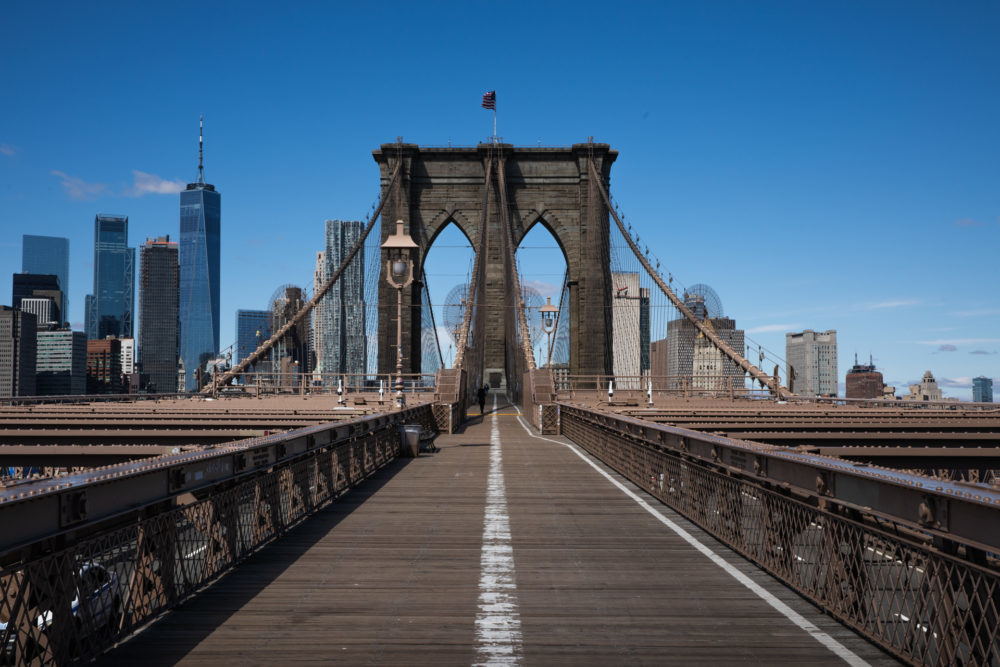 The Brooklyn Bridge walkway and bike path is almost completely empty on the Brooklyn side a little after noon on March 24, 2020. Photo: Paul Frangipane/Brooklyn Eagle