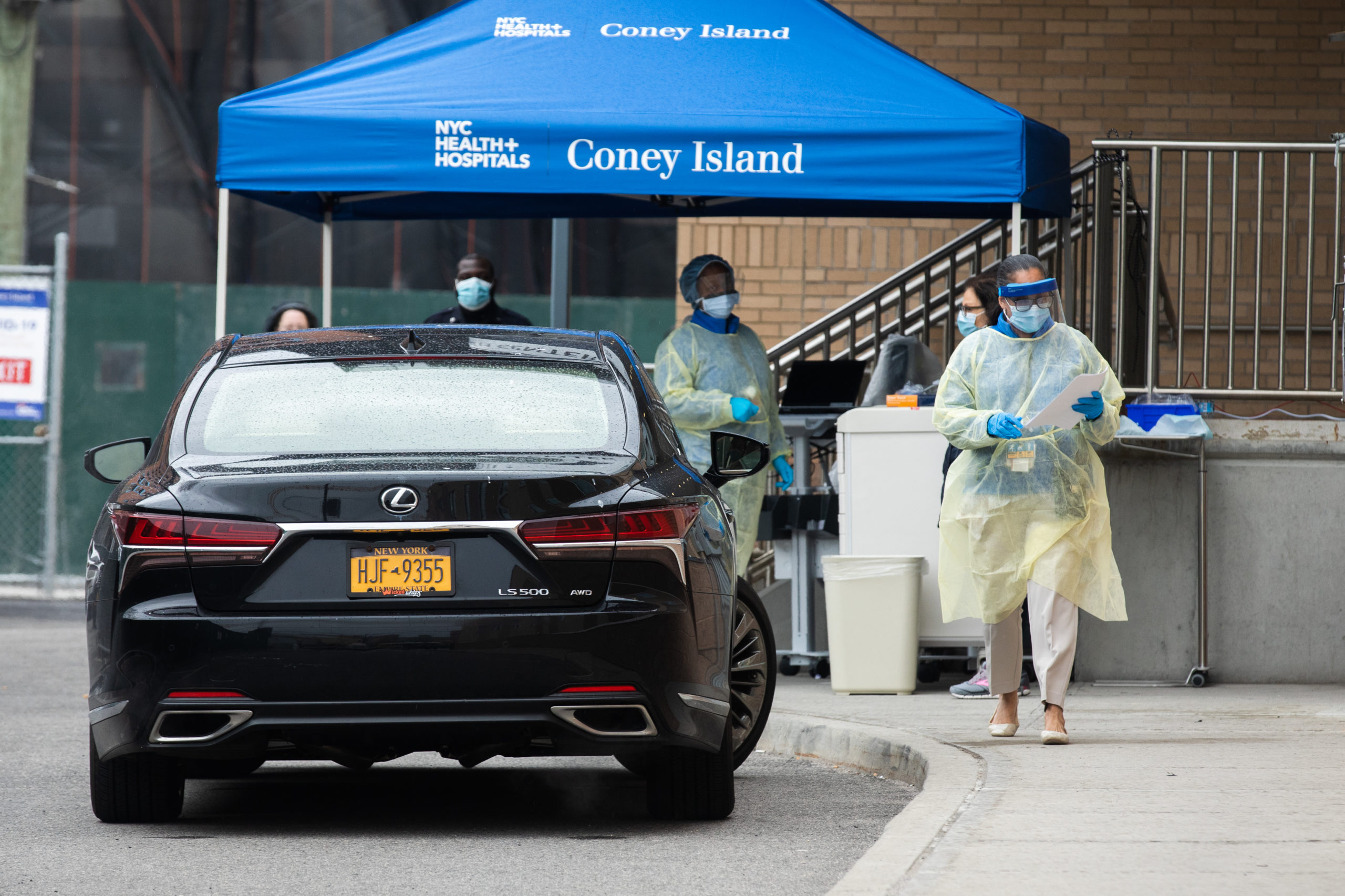 Health care workers prepare to take a coronavirus test from a patient at the newly-opened drive-through testing site in Coney Island. Photo: Paul Frangipane/Brooklyn Eagle