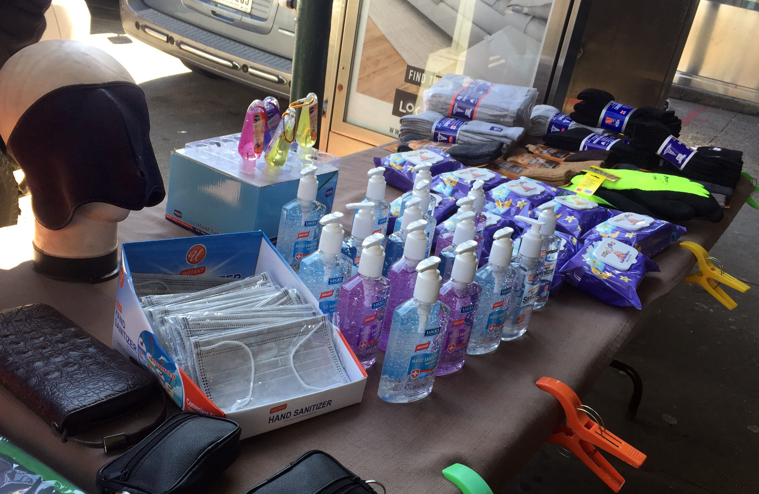 A street vendor was doing a brisk business on Monday selling hand sanitizer and surgical masks. Photo: Alex Williamson/Brooklyn Eagle