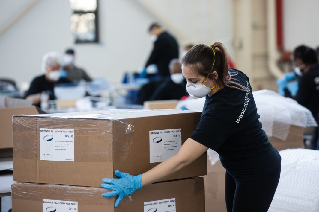 Industrial firms Duggal Visual Solutions and Bednark are using their spaces in the Brooklyn Navy Yard to manufacture personal protective equipment for local hospitals. Company workers built face shields in the warehouse on March 26, 2020. Photo: Paul Frangipane/Brooklyn Eagle