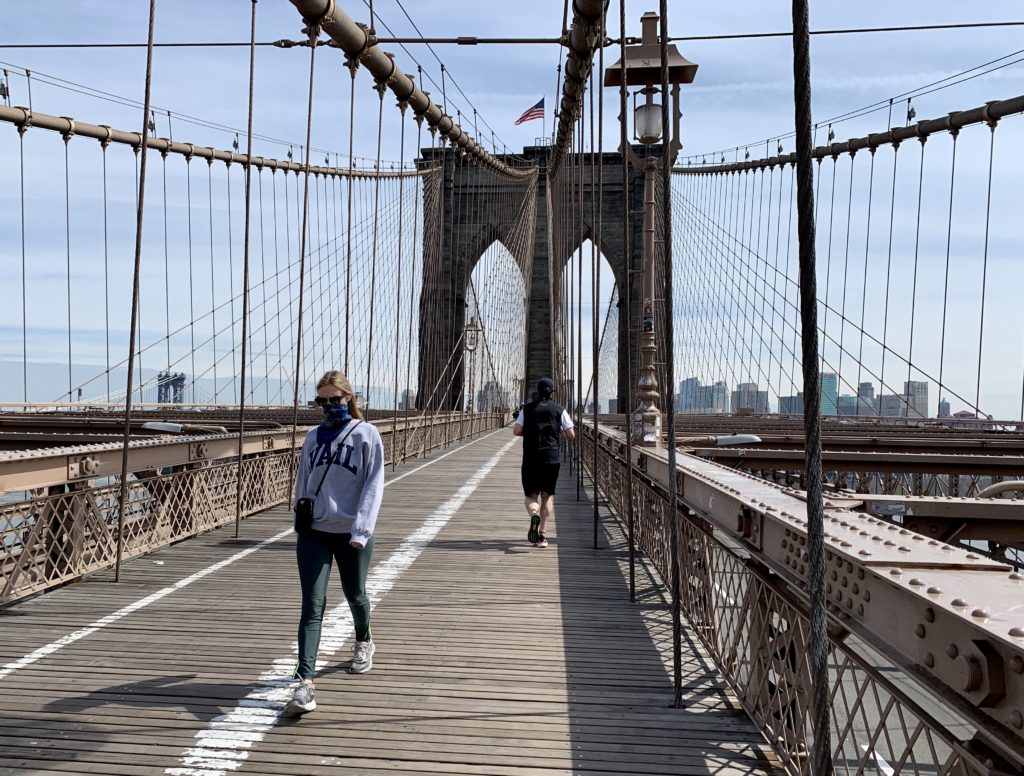 Gov. Andrew Cuomo says police are going to crack down on people violating the coronavirus social distancing guidelines, and fines are increasing from $500 to $1,000. The Brooklyn Bridge walkway was much emptier than usual on Sunday, however. Photo: Mary Frost