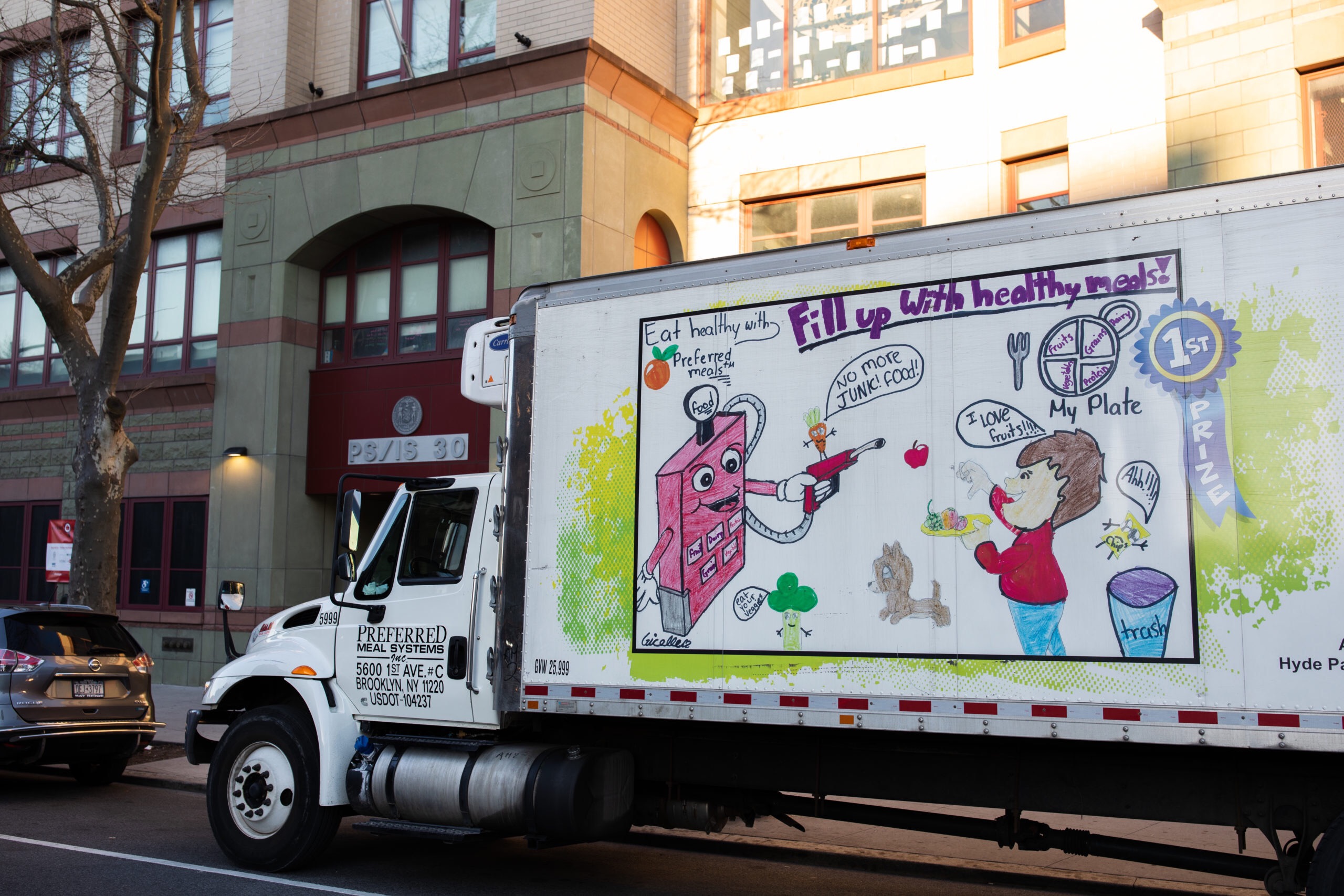 A food supplier truck parked outside of P.S./I.S. 30, one of 400 Meal Hubs where any New York City resident can pick up free meals Mondays through Fridays. Photo: Paul Frangipane/Brooklyn Eagle