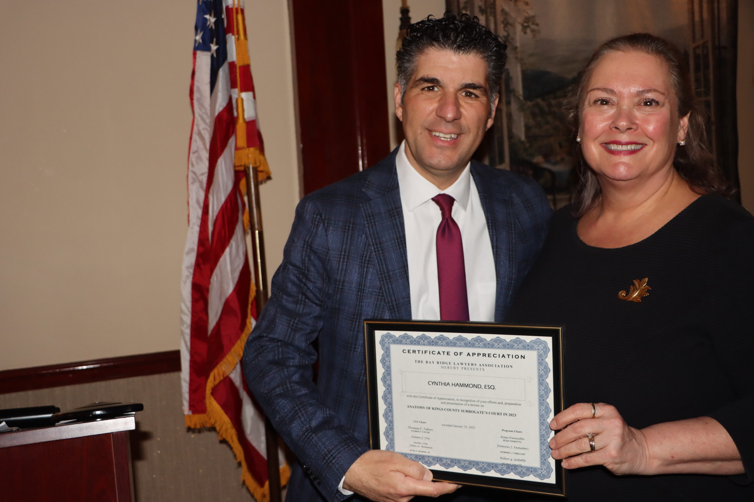 President Dominic Famulari presents Cynthia Hammond with a certificate for presenting a continuing legal education seminar entitled, 