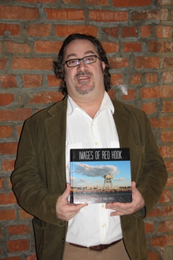 Photographer Thomas Rupolo with his book, "Iimages of Red Hook."