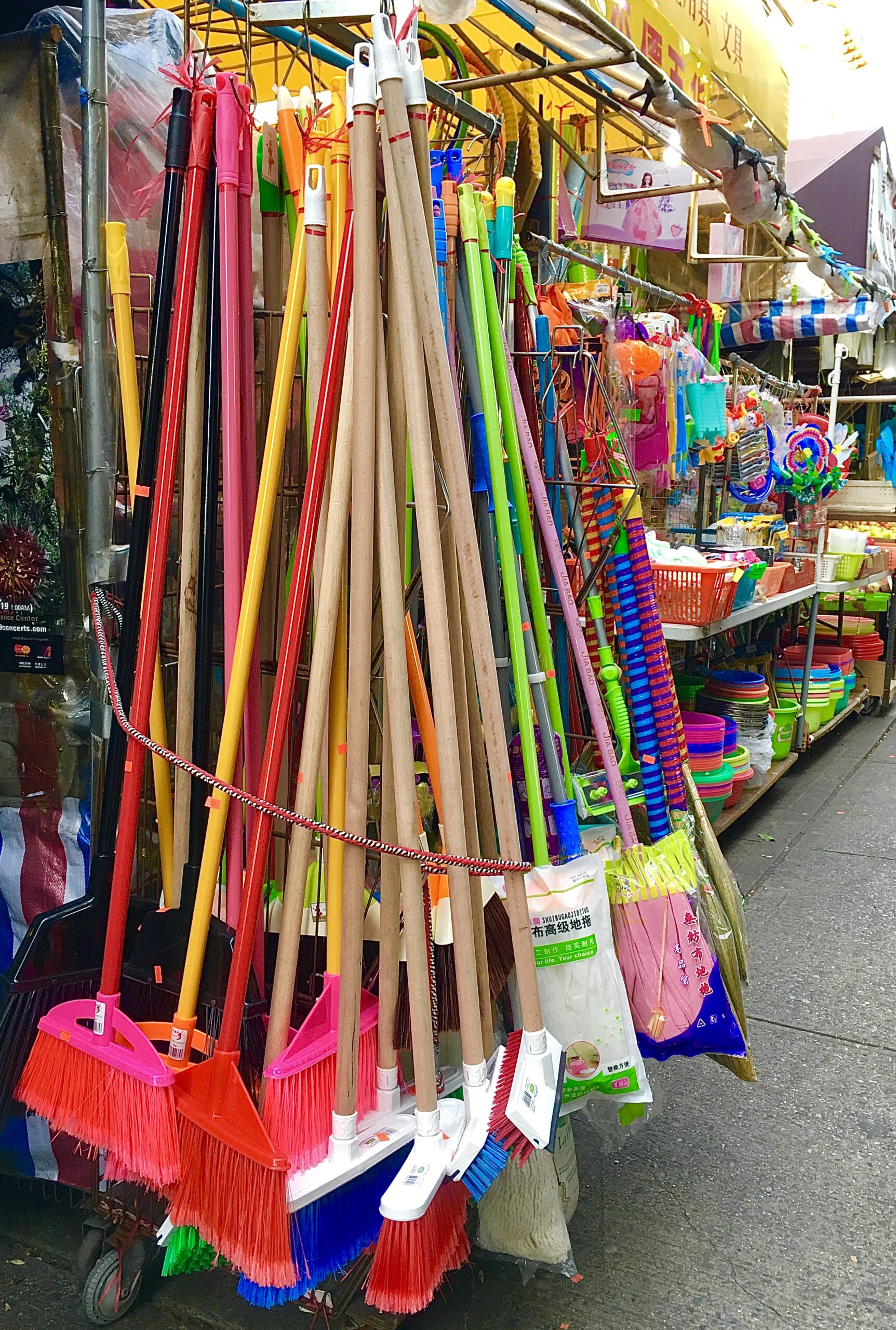 Colorful brooms are for sale at Xiang He Inc. on 86th Street in Bensonhurst. Eagle photo by Lore Croghan
