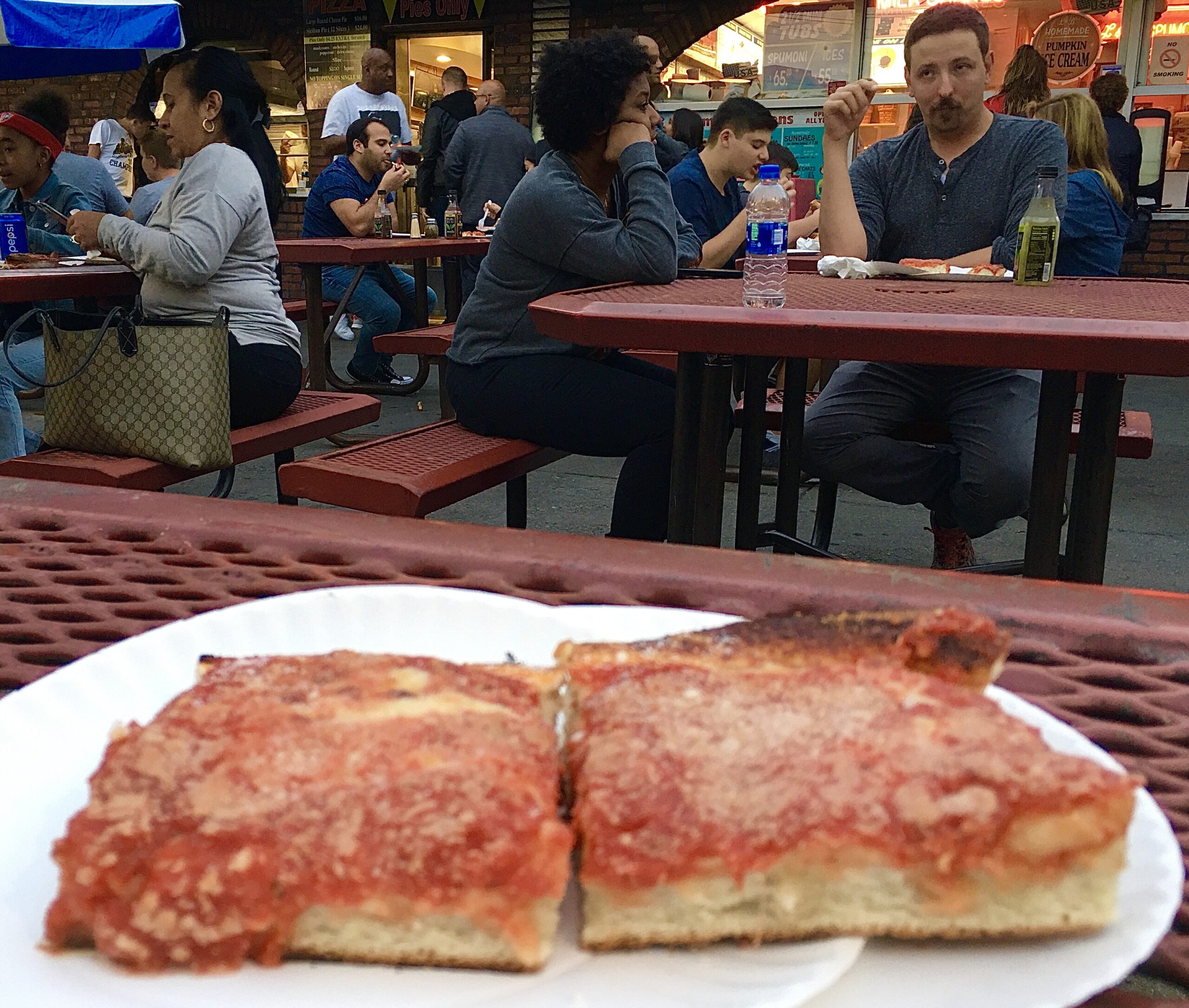 The pizza draws locals and tourists to L&B Spumoni Gardens. Eagle photo by Lore Croghan 