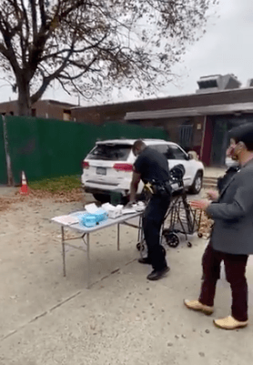 Officers confiscate PPE set up by volunteers outside Red Hook polling center