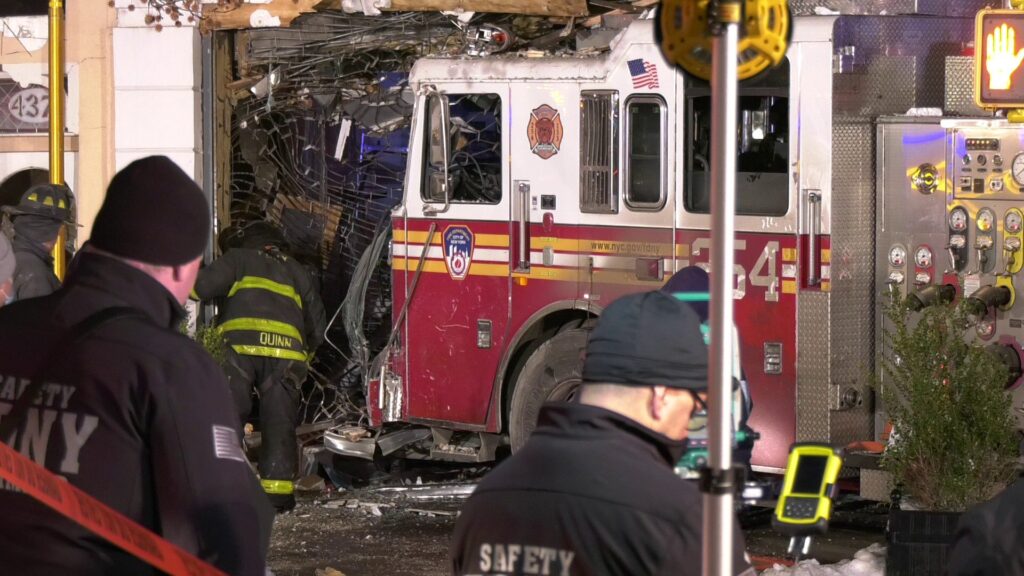 Fire truck crashes into clothing store; six injured