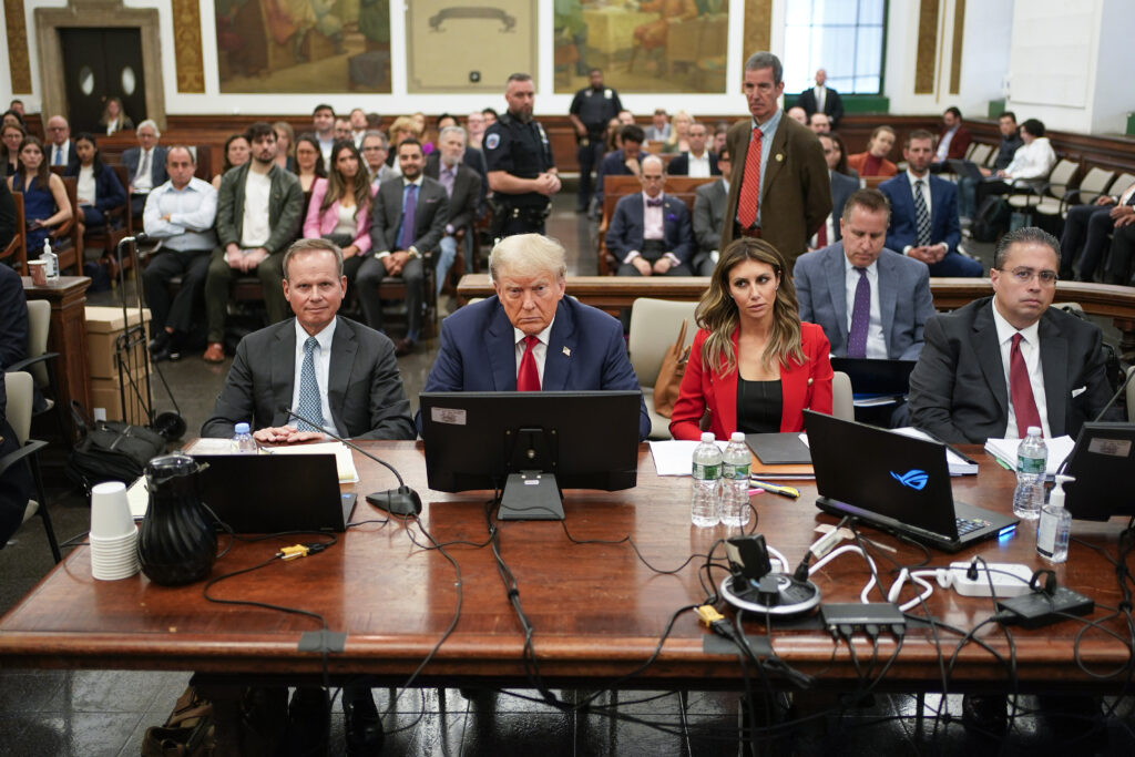 Former President Donald Trump, center, sits in the courtroom with his legal team