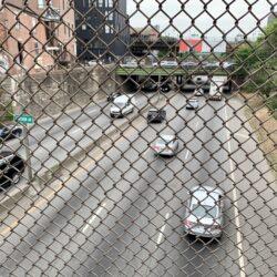 Cars drive by on the Brooklyn-Queens Expressway