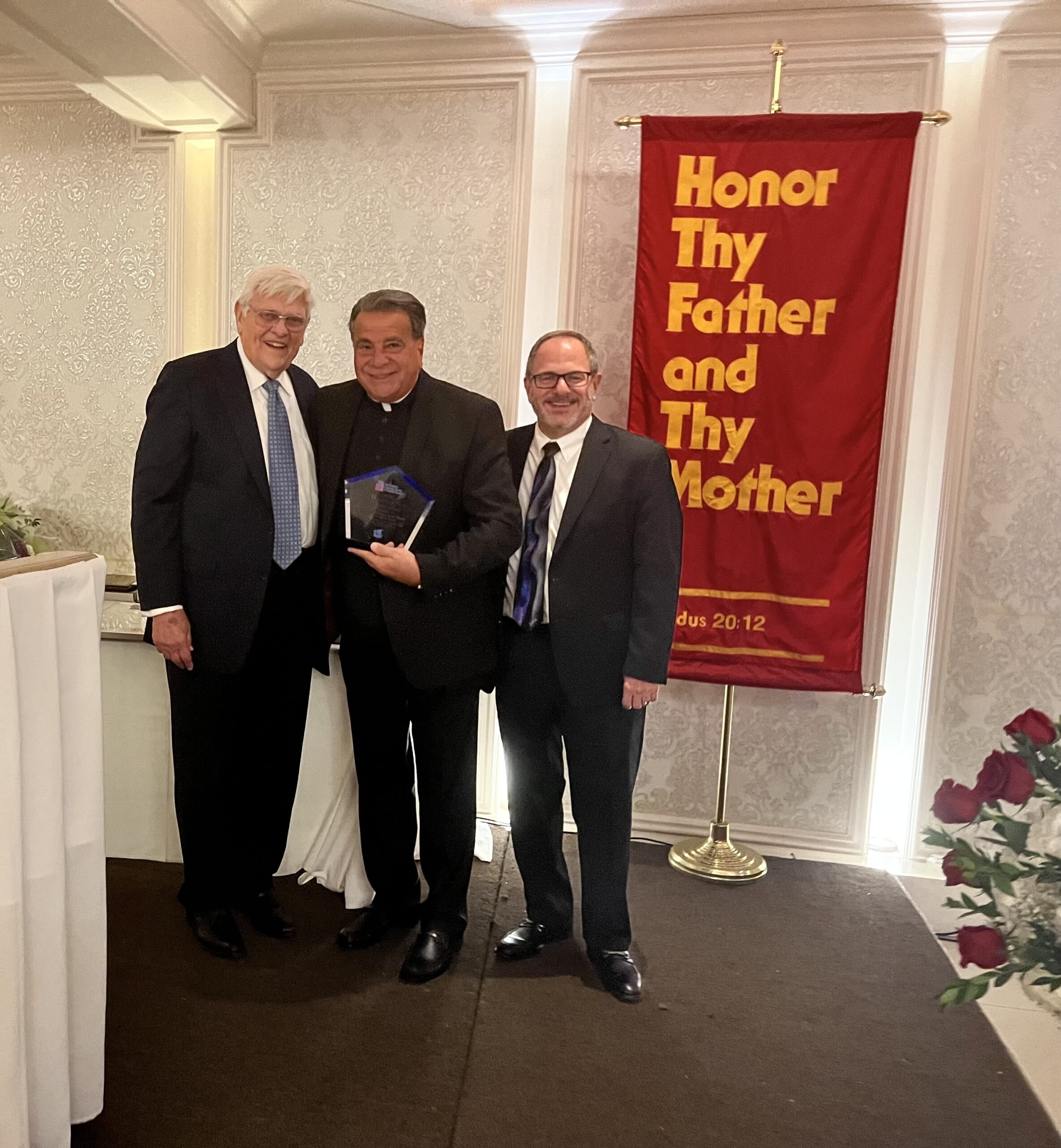From left: George A. Jensen, chairman of the board; Rev. Monsignor David Cassato, vicar for Catholic Schools; Anthony J. Restaino, executive director.