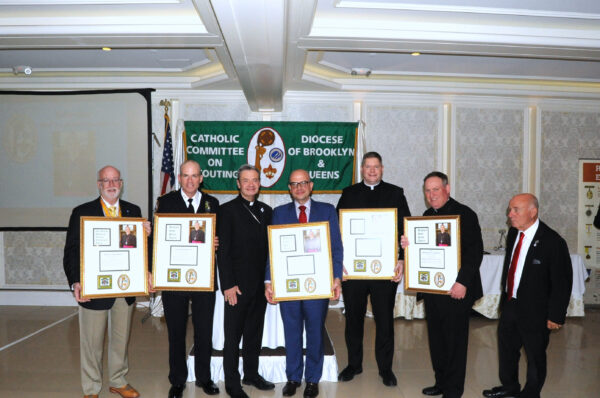 (From left) Deacon Jim Noble; Assistant Chief Charles McEvoy; Bishop Robert Brennan; Antonio Biondi, former president, Cathedral Club of Brooklyn; Fr. Patrick Keating, Esq.; Bishop Kevin Sweeney; and Brian Long, diocesan scouting director.