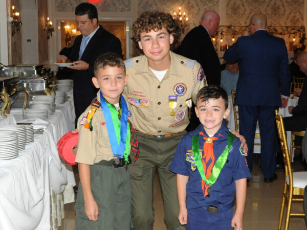 (From left) Scouts from St. Athanasius Parish: Lucas Senatore; Jake Harmon; and Leonardo Senatore.
