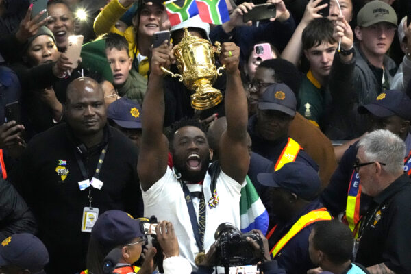 SOUTH AFRICA — Bringing the gold to Jo’Burg: South Africa's Siya Kolisi holds the Webb Ellis trophy as fans welcome South Africa' Springbok team during their arrival at O.R Tambo's international airport in Johannesburg, South Africa, Tuesday Oct. 31, 2023, after the Rugby World Cup.Photo: Themba Hadebe/AP