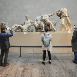 LONDON — Controversial, and headless, ancient marble sculptures attract tourists: Visitors look at ancient sculptures that are part of the Parthenon Marbles at the British Museum in London, Tuesday, Nov. 28, 2023. Greek officials said Tuesday, Nov. 28, 2023, that they will continue talks with the British Museum on bringing the Parthenon Marbles back to Athens, despite U.K. Prime Minister Rishi Sunak canceling a meeting with his Greek counterpart where the contested antiquities were due to be discussed.Photo: Kirsty Wigglesworth/AP