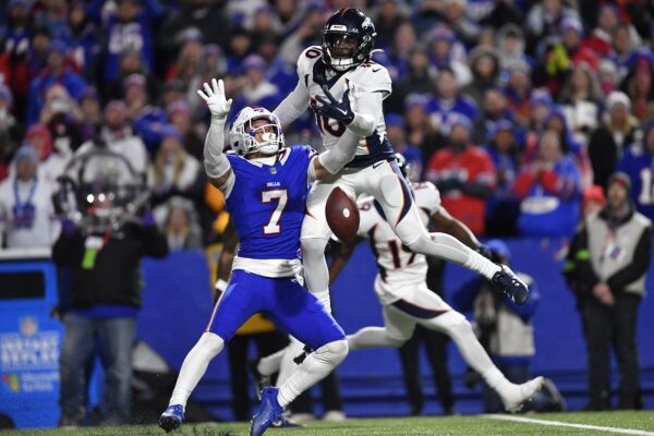 <b>BUFFALO — ‘Interference?? I was just breaking his fall’:</b> Buffalo Bills’ Taron Johnson (7), left, breaks up a pass intended for Denver Broncos’ Jerry Jeudy, top, during the second half of an NFL football game, Monday, Nov. 13, 2023, in Orchard Park, N.Y. Johnson was called for pass interference on the play, allowing the Broncos to move into field goal range and win the game.<br>Photo: Adrian Kraus/AP