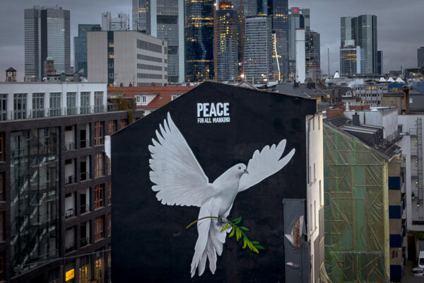 <strong>FRANKFURT — German mural urges peace:</strong> A peace mural showing a dove by artist Justus Becker is painted on a wall in Frankfurt, Germany, Tuesday, Nov. 7, 2023. At the beginning of the war in Ukraine, a branch in Ukrainian colors was seen on the mural, now it was changed and has letters reading "Peace for all mankind."<br>Photo: Michael Probst/AP
