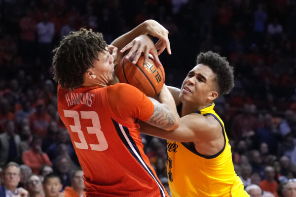 <b>ILLINOIS — ‘Gimme the ball, gimme the ball, gimme the ball’:</b> Illinois forward Coleman Hawkins (33) fouls Marquette forward Oso Ighodaro as he tries to wrestle the ball from Ighodaro during the second half of an NCAA college basketball game Tuesday, Nov. 14, 2023, in Champaign, Ill. <br>Photo: Charles Rex Arbogast/AP