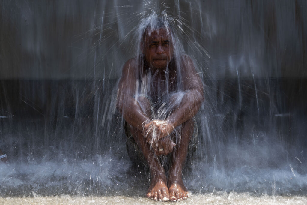 RIO DE JANEIRO — Nature’s revenge and a brief cure: A man cools off in a water fountain at Madureira Park amid a heat wave in Rio de Janeiro, Brazil, Wednesday, Nov. 15, 2023.Photo: Bruna Prado/AP