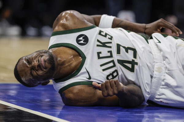 ORLANDO — The game is fast, protective pads are few and the floor is hard: Milwaukee Bucks forward Thanasis Antetokounmpo grimaces on the floor during the second half of the team's NBA basketball game against the Orlando Magic, Saturday, Nov. 11, 2023, in Orlando, Fla.<br>Photo: Kevin Kolczynski/AP