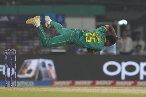 <b>INDIA — Dedication to the sport, going airborne and horizontal:</b> South Africa's Kagiso Rabada loses his balance after a delivery during the ICC Men's Cricket World Cup second semifinal match between Australia and South Africa in Kolkata, India, Thursday, Nov. 16, 2023.<br>Photo: Bikas Das/AP