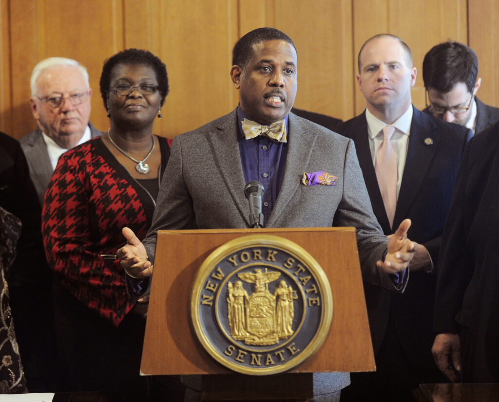 n this Feb. 6, 2017, file photo, state Sen. Kevin Parker, D- Brooklyn, stands at the podium, flanked by Senate members during a news conference at the Capitol in Albany, N.Y.