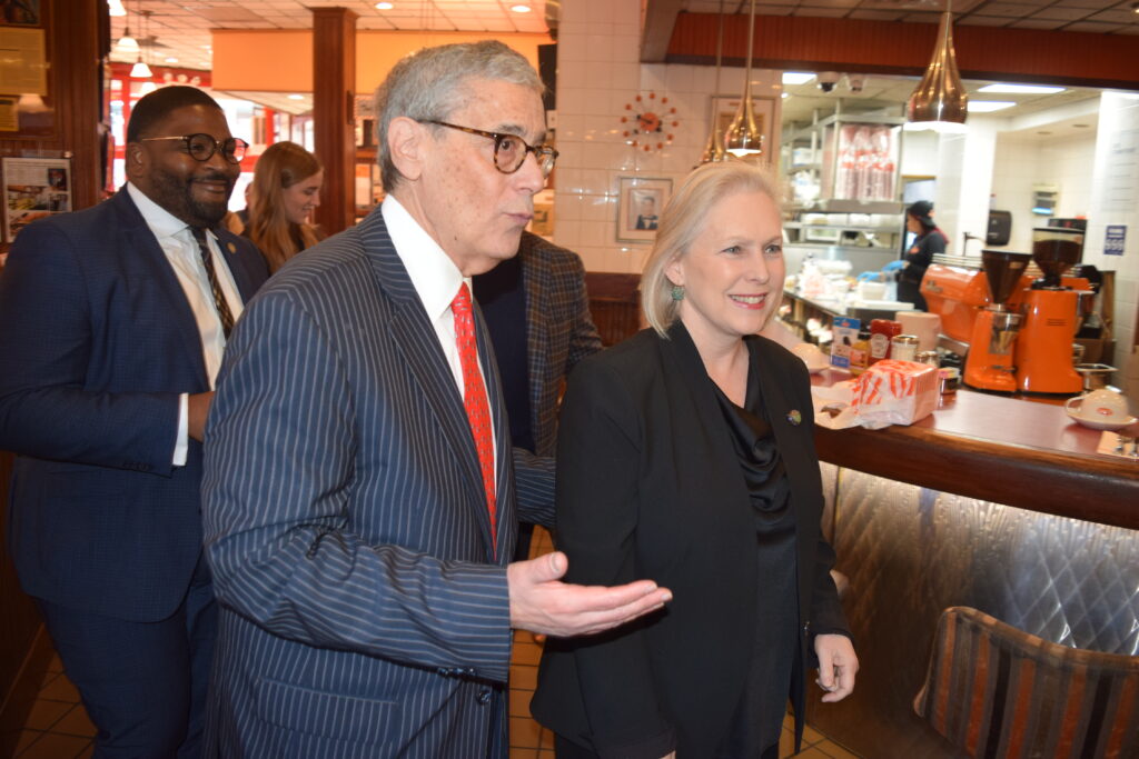 Sen. Kirsten Gillibrand and political leader Steve Cohn arrive at Junior's Restaurant in Downtown Brooklyn for the annual Cheesecake Breakfast, a key gathering of Brooklyn's political community.