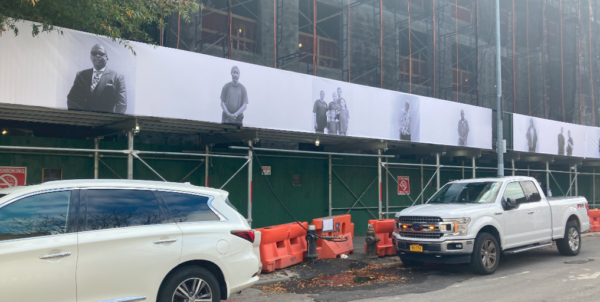 Laurent Chevalier’s photography of Brownsville residents is displayed on the East New York Avenue side.