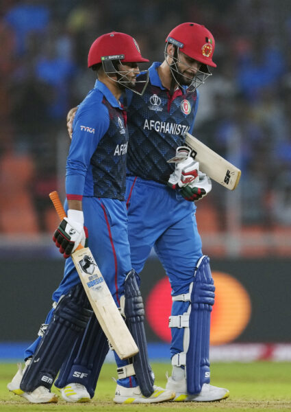 <b>INDIA – The sport of colonization, cricket’s popularity has outlived that of its origins:</b> Afghanistan's Azmatullah Omarzai, left, is comforted by teammate Naveen-ul-Haq after failing to finish his century during the ICC Men's Cricket World Cup match between Afghanistan and South Africa in Ahmedabad, India, Friday, Nov. 10, 2023.<br>Photo: Ajit Solanki/AP