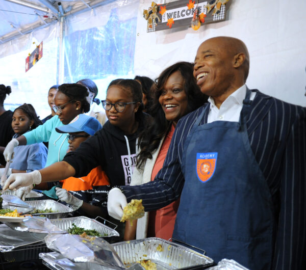 New York City Mayor Eric Adams (right) serving it up for a good cause at Kings Cares Thanksgiving luncheon.Photos by Arthur Degaeta