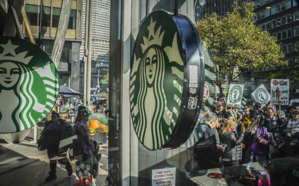 <b>MANHATTAN — Barista revolt on ‘Red Cup Day’:</b> A coalition of unions and supporters join Starbucks workers at a rally outside a midtown Manhattan Starbucks coffee store, calling for “fair schedules and wages,” Thursday, Nov. 16, 2023, in New York.<br>Photo: Bebeto Matthews/AP